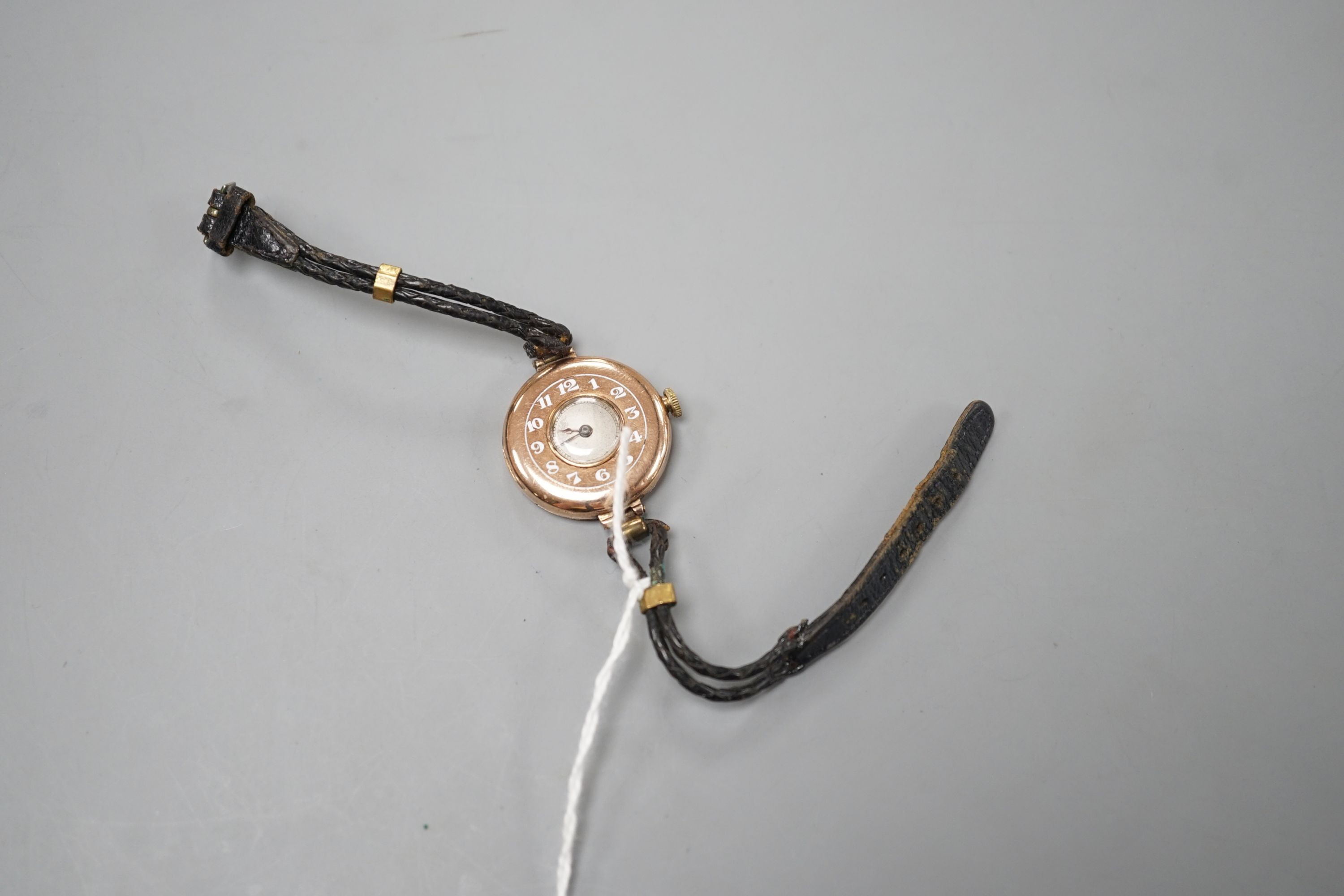 A lady's George V 9ct gold Rolex manual wind wrist watch, with Arabic chapter ring, case hallmarked for London, 1919, on a leather strap, case diameter 26mm, gross weight 16.2 grams.